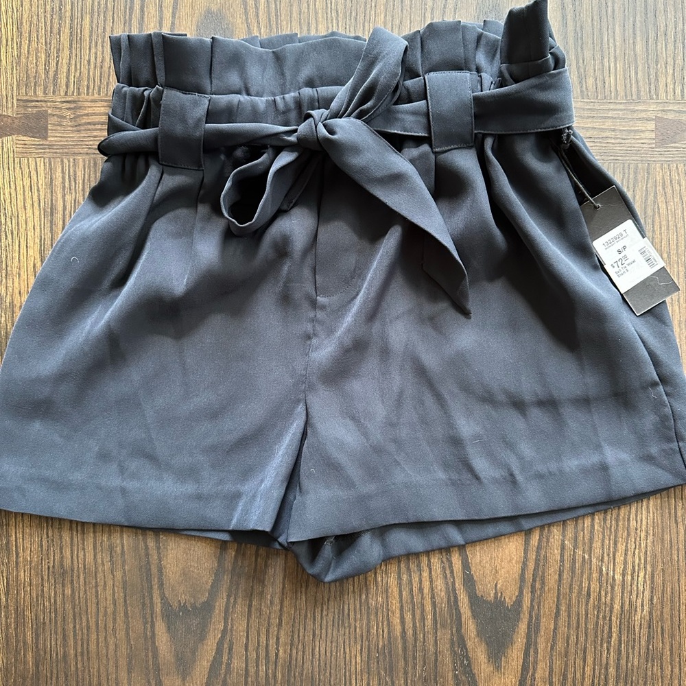 Brand new black tie up dressy shorts. Wear with heels or wear them more casual.